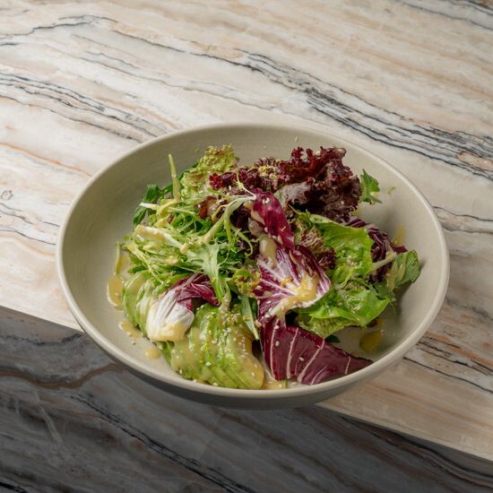 Green leaves salad mustard dressing