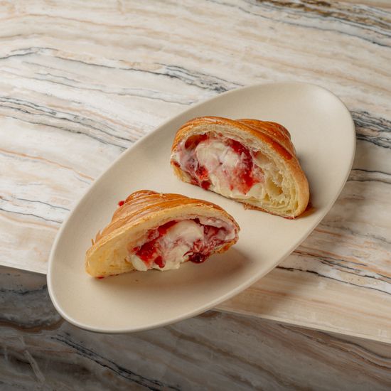 Croissant, cream, strawberry jam