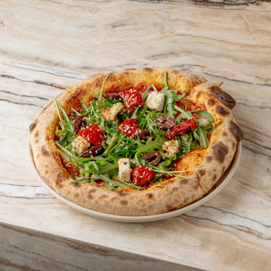 Sun dried tomatoes, vegan cheese, olives, arugula